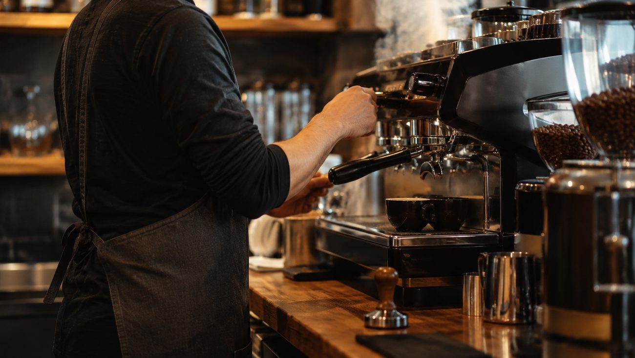 Barista pulling a shot on an espresso machine